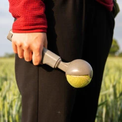 Kompact 9 Retractable Dog Ball Launcher -PetJoy Shop product image in situ hold